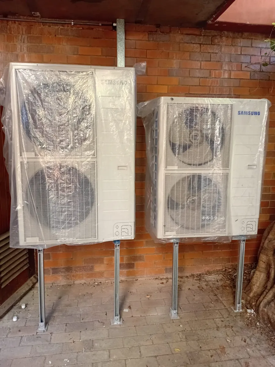 Two commercial Samsung outdoor air-conditioning units installed on steel stands
