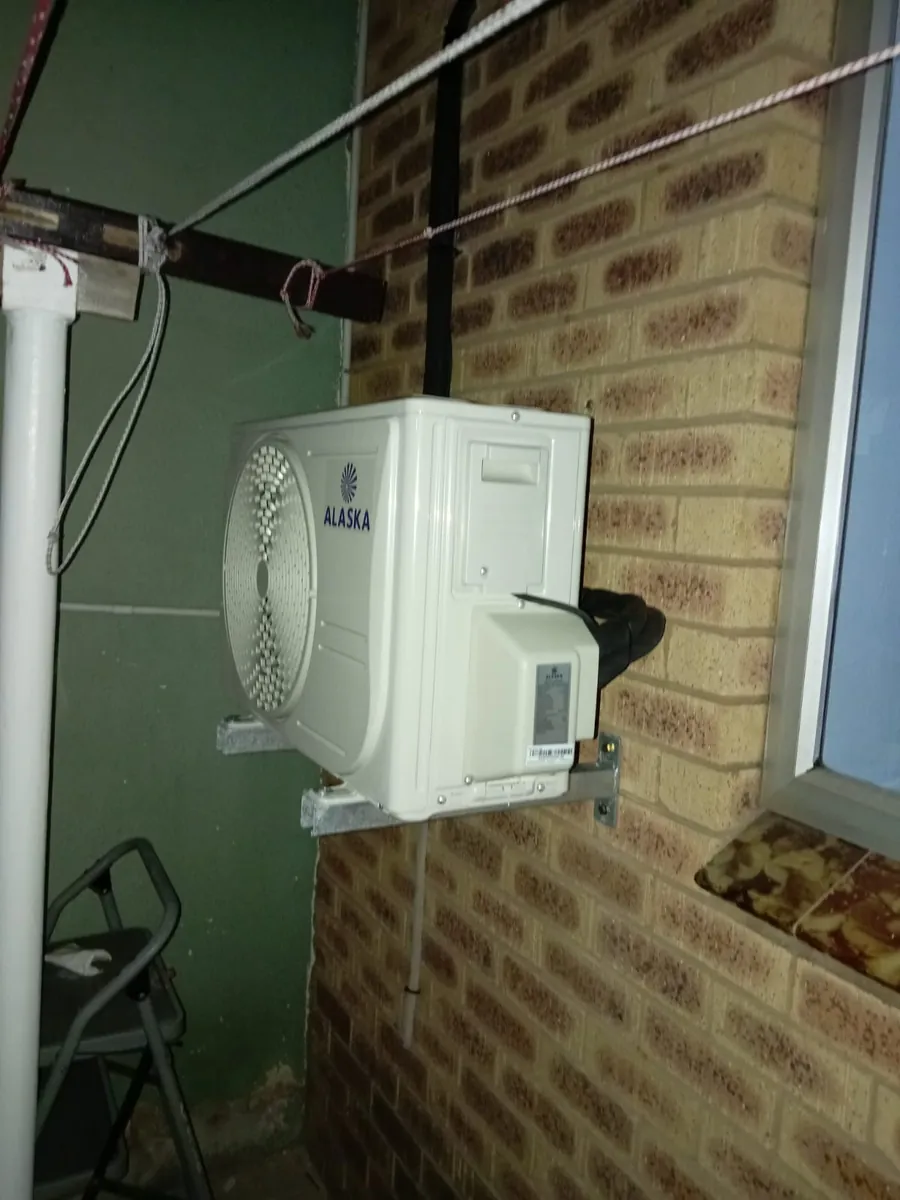 Split unit outdoor condenser mounted on a wall bracket